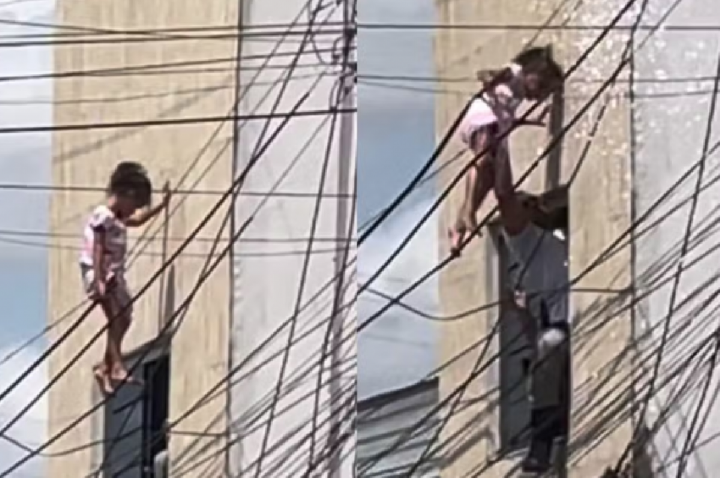 Criança fica presa em fiação após cair de janela